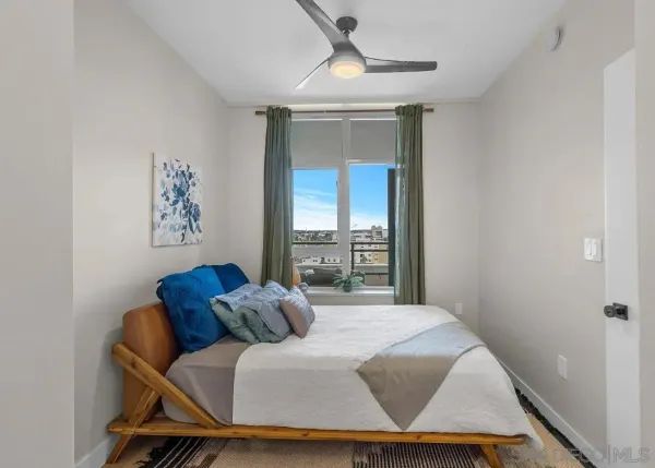 a room with a bed and a window