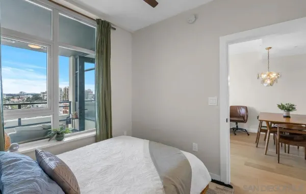 a bedroom with a bed and a table