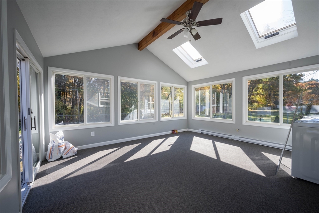 197 Andover Road Billerica, MA 01821 - Photo 17 of 42 a view of a bedroom with large windows and a bed