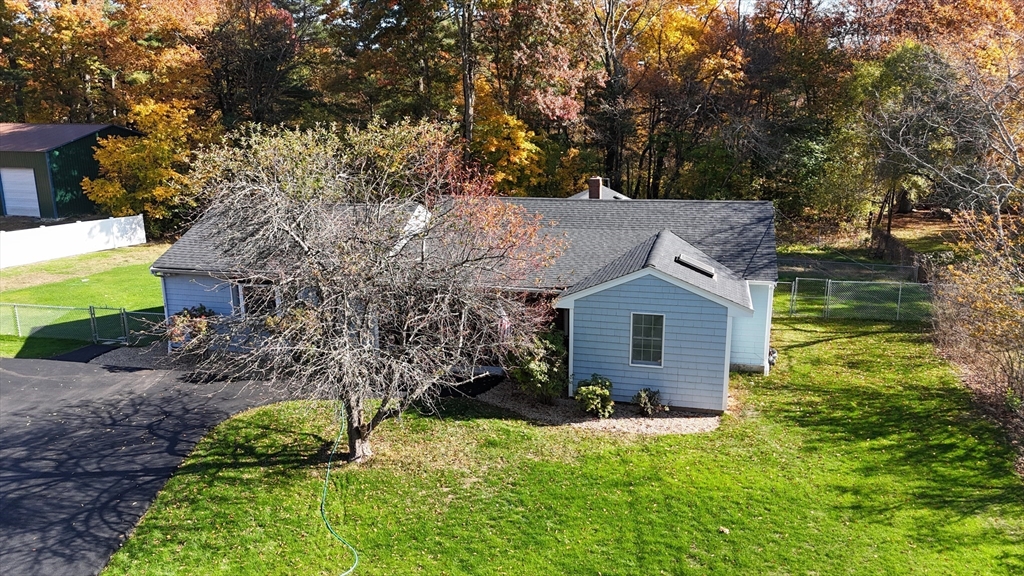 197 Andover Road Billerica, MA 01821 - Photo 39 of 42 a view of a brick house with a yard and large trees