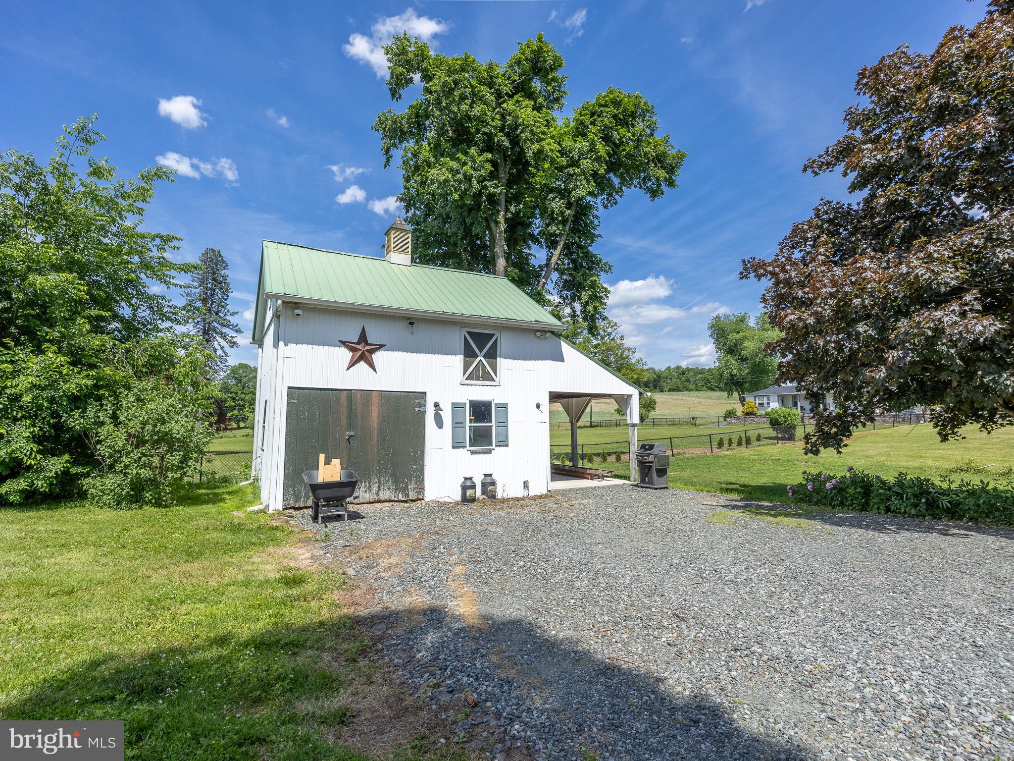 225 Niantic Road Barto, PA 19504 - Photo 67 of 82 a front view of a house with a yard and garage