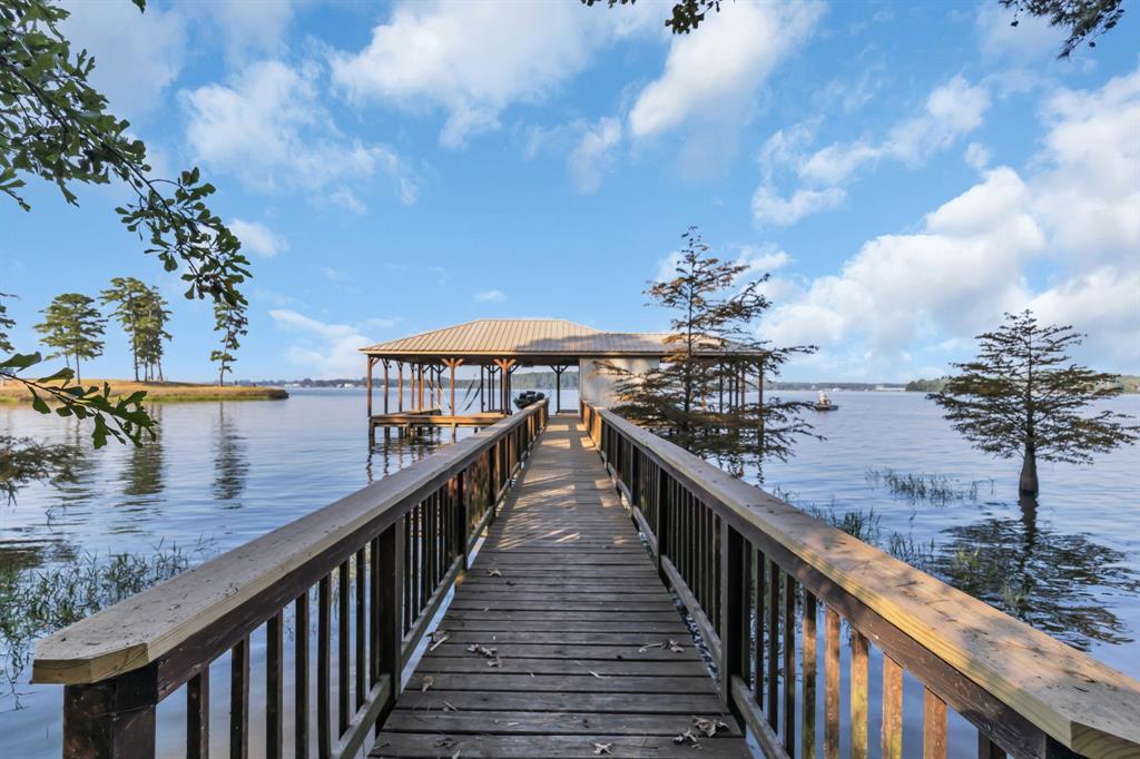 Dock area featuring a water view