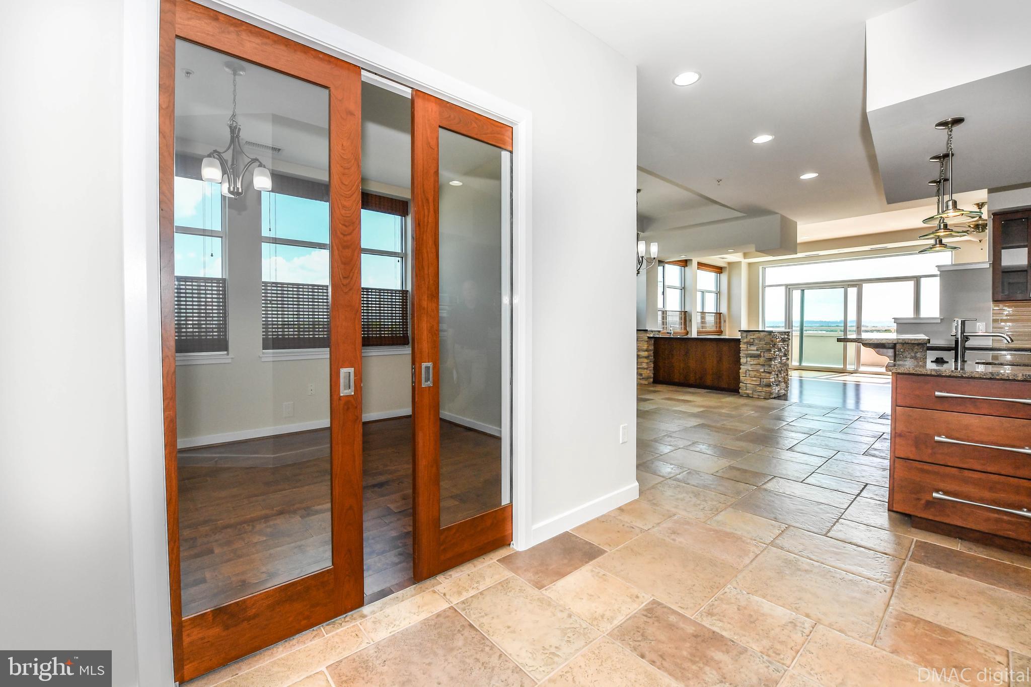 50 Citizen's Way, Unit 604 Frederick, MD 21701 - Photo 13 of 53 Pocket doors to formal dining room / office