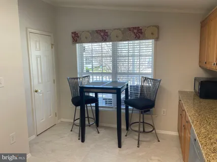 a view of a livingroom with furniture and a window