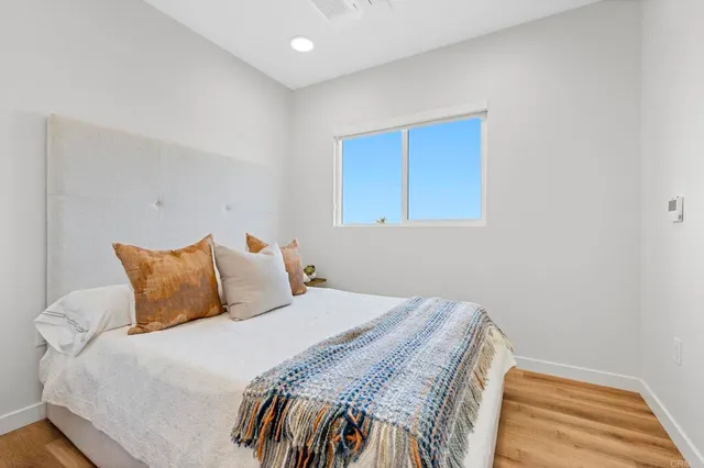 a bedroom with a bed and a table