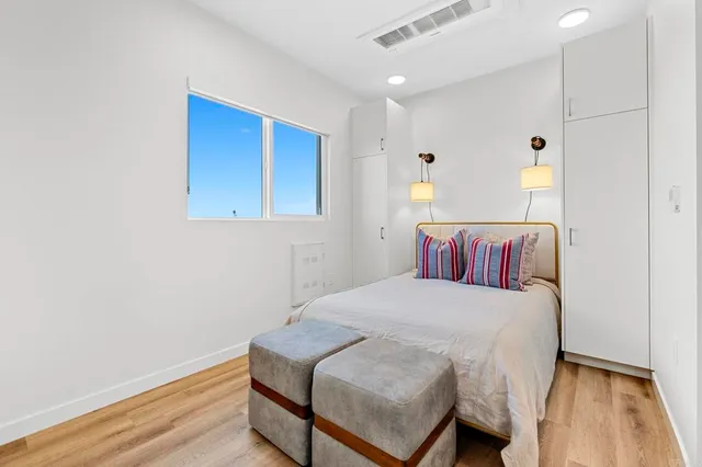 a view of a balcony with chair and wooden floor