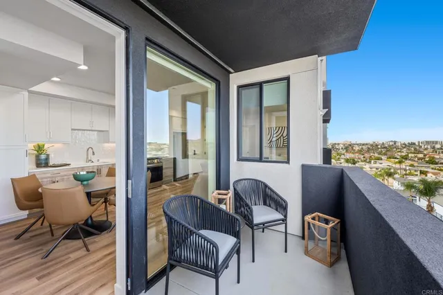 a kitchen with a table chairs refrigerator and sink