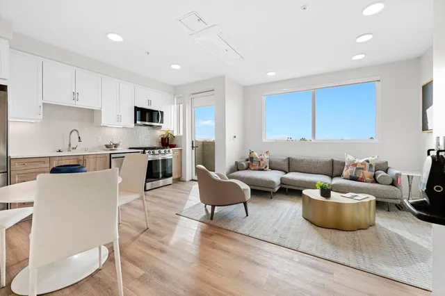 a bathroom with a double vanity sink toilet and shower