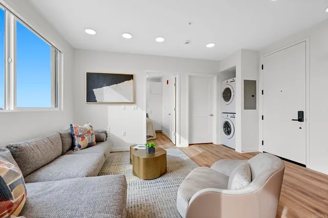 a bedroom with a bed and a chair