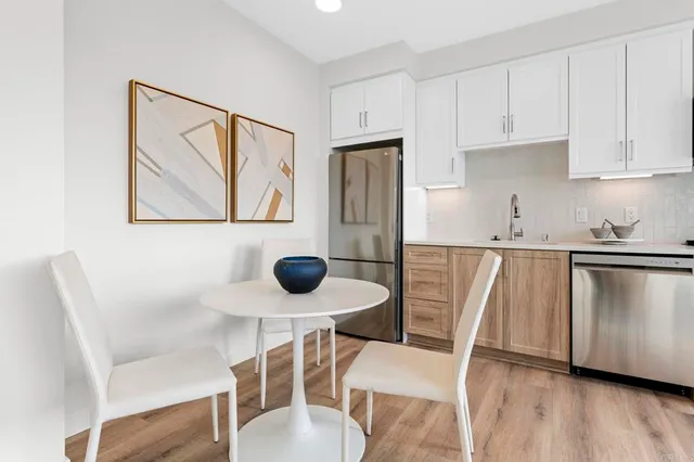 a view of open kitchen with wooden floor