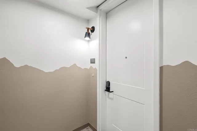 an empty room with wooden floor and a window