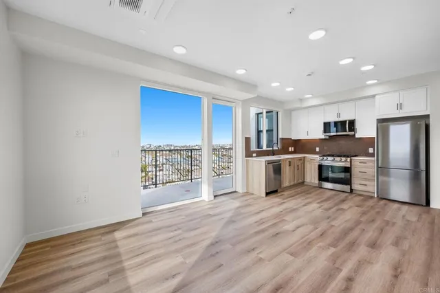 a view of a kitchen with a sink cabinets and a window
