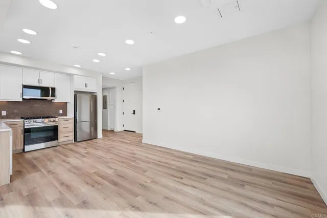 a view of an empty room with a window