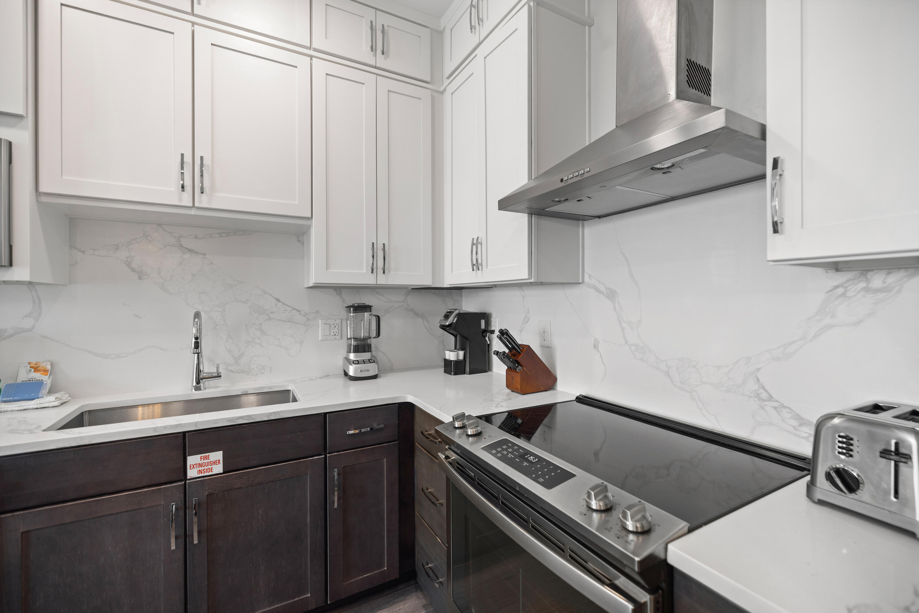 201 Henderson Resort Way, Unit 2202 Destin, FL 32541 - Photo 12 of 48 a kitchen with a sink and cabinets