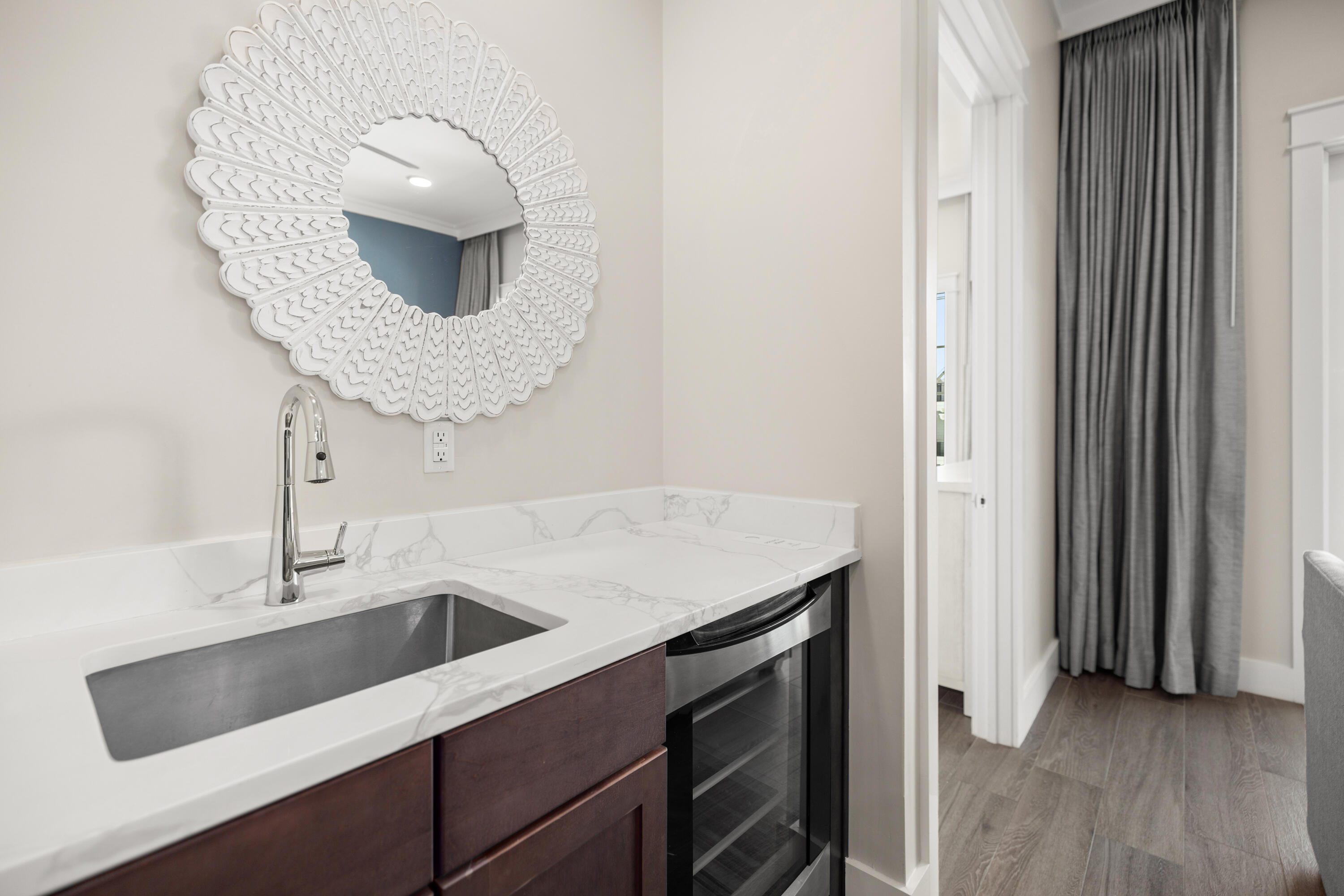 201 Henderson Resort Way, Unit 2202 Destin, FL 32541 - Photo 14 of 48 a kitchen with a sink and a mirror