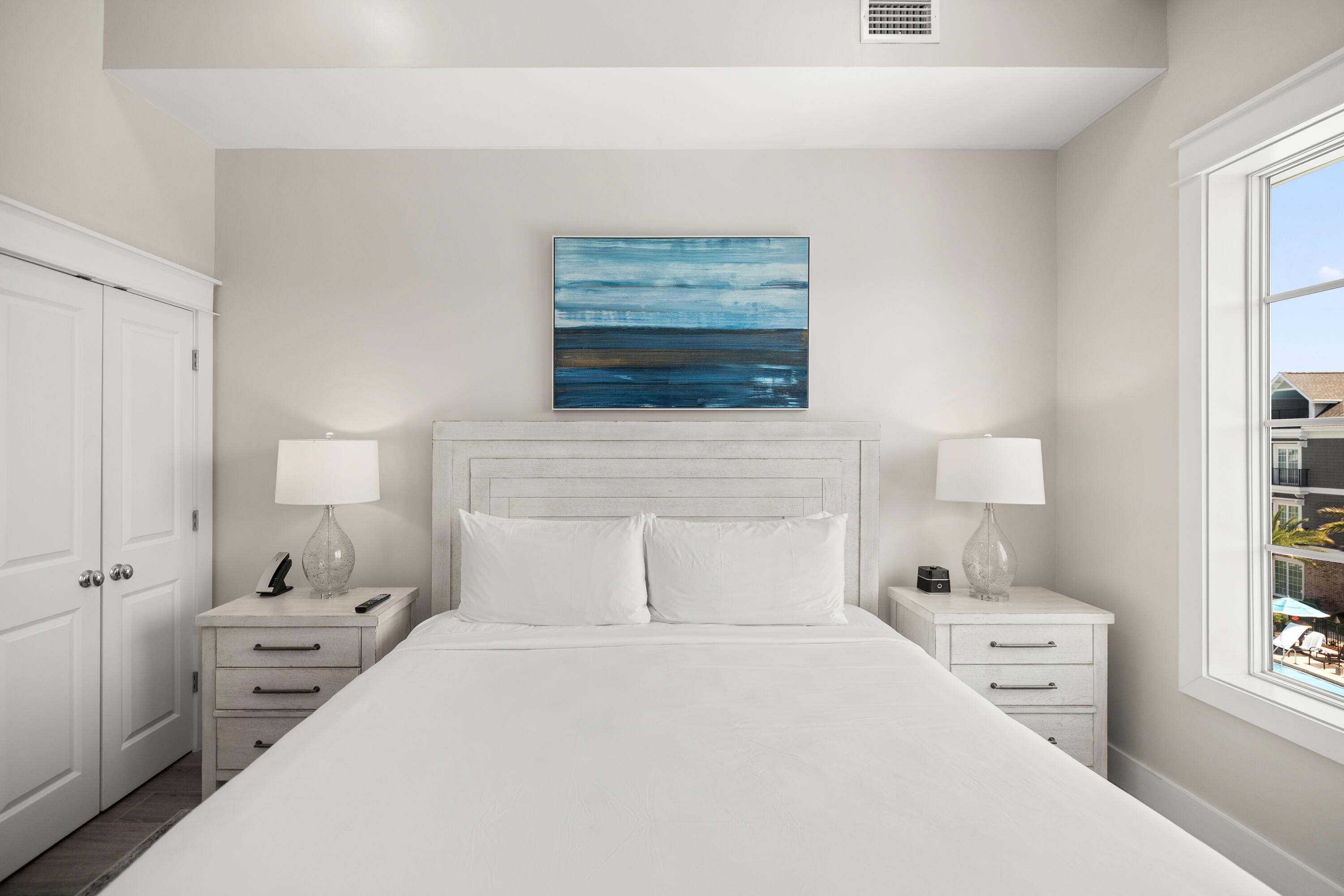 201 Henderson Resort Way, Unit 2202 Destin, FL 32541 - Photo 16 of 48 a bedroom with a bed and a window