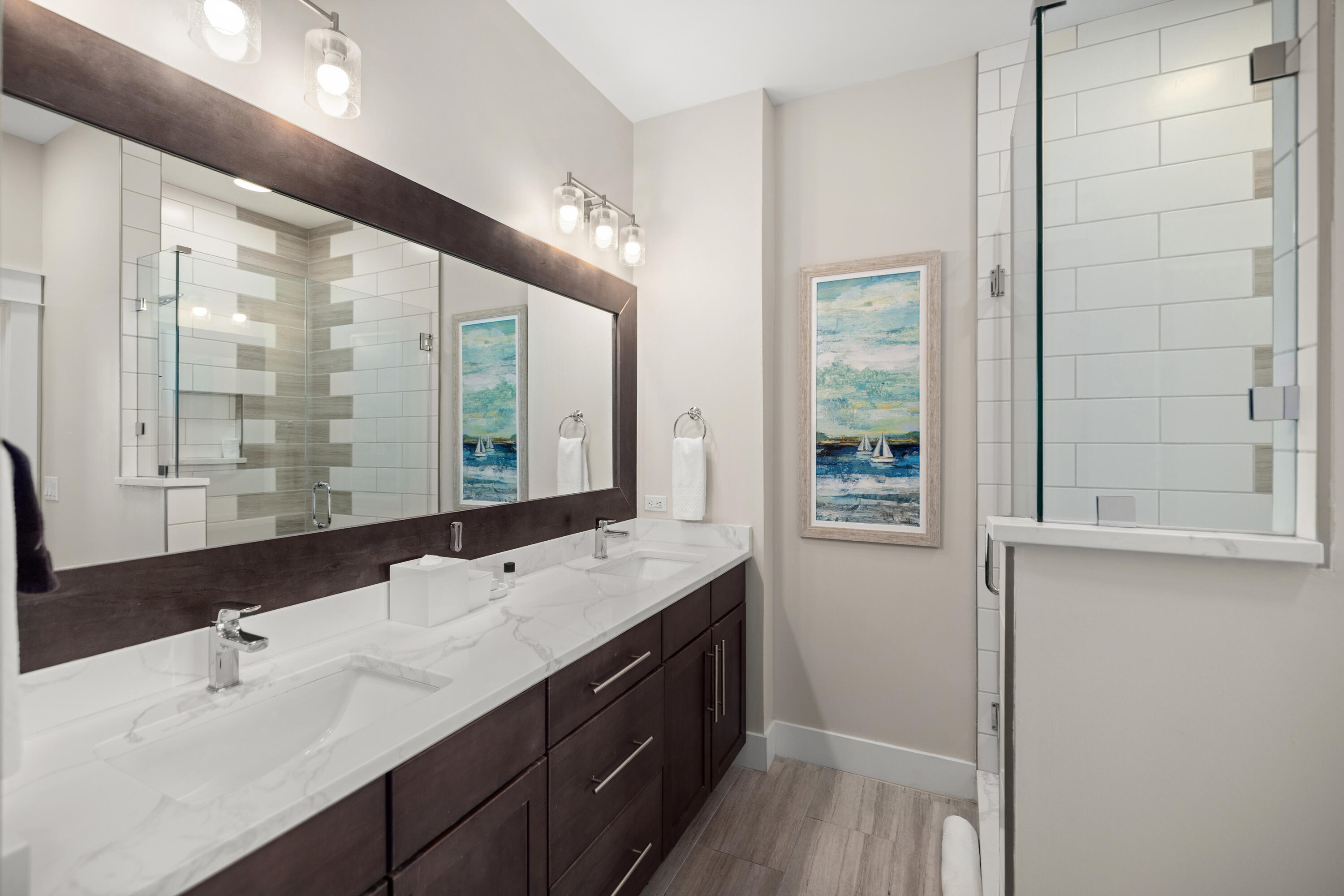 201 Henderson Resort Way, Unit 2202 Destin, FL 32541 - Photo 17 of 48 a bathroom with a double vanity sink and mirror