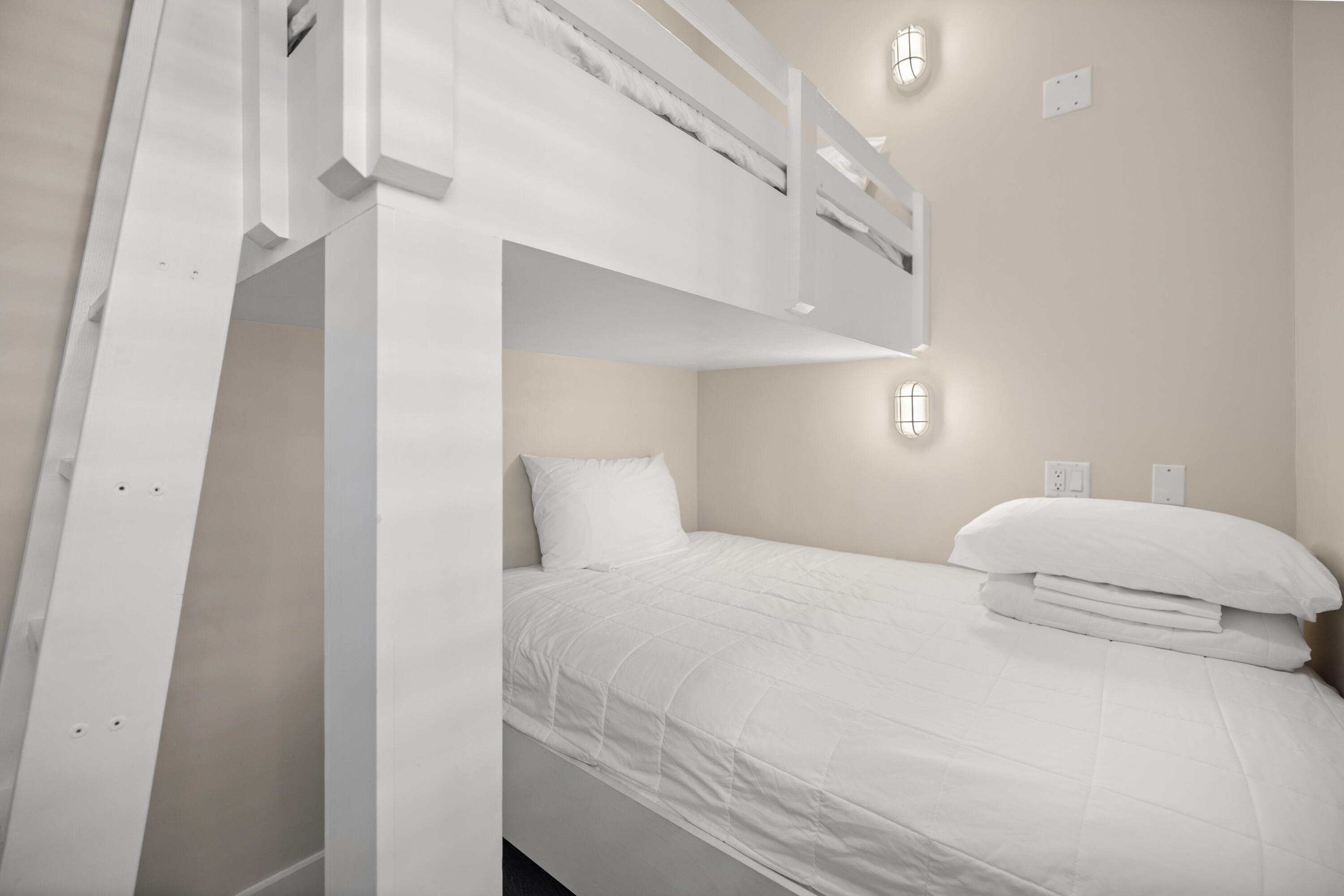 201 Henderson Resort Way, Unit 2202 Destin, FL 32541 - Photo 21 of 48 a bedroom with a bed and a night stand