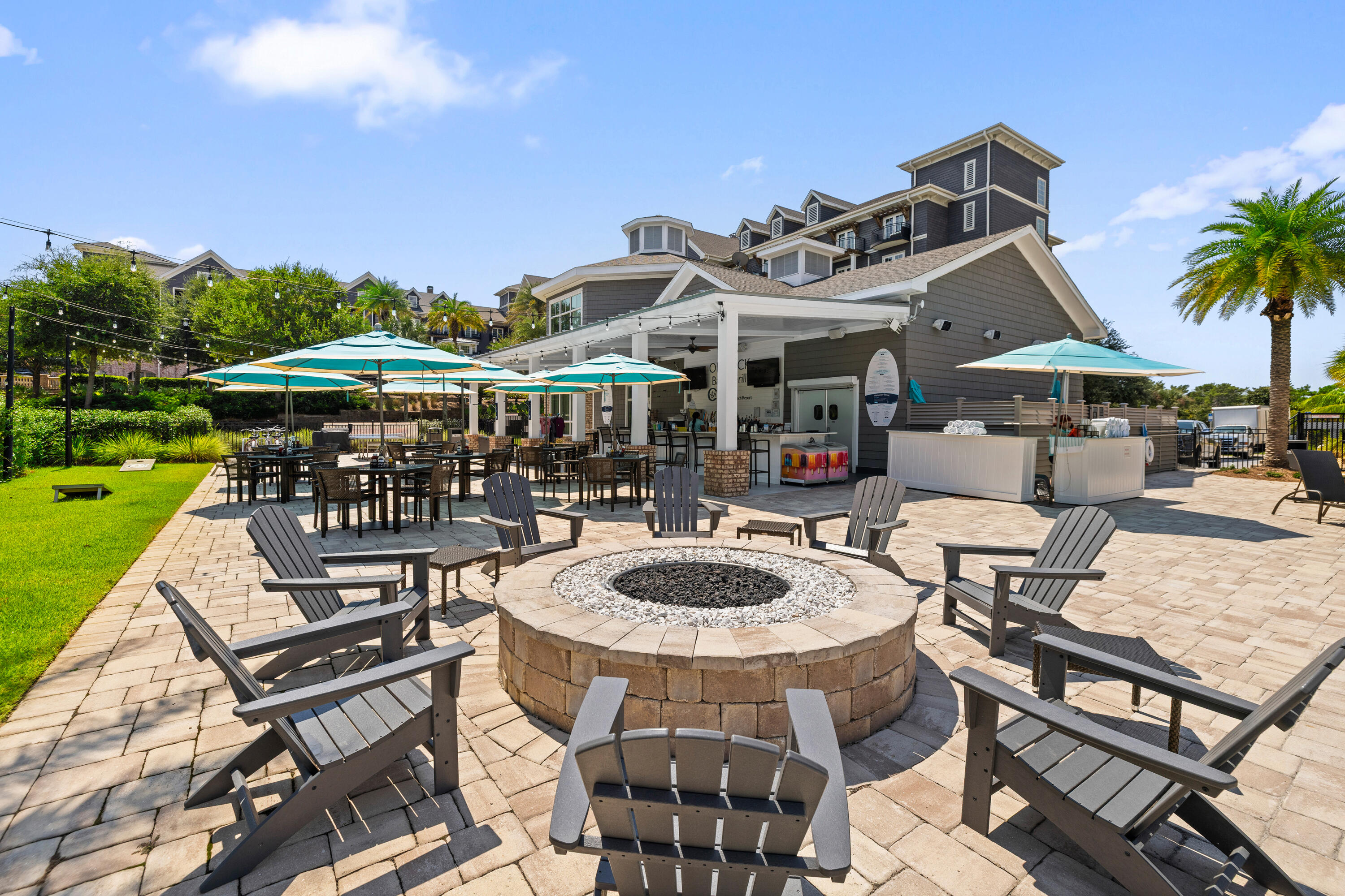 201 Henderson Resort Way, Unit 2202 Destin, FL 32541 - Photo 34 of 48 a view of a patio with a table and chairs