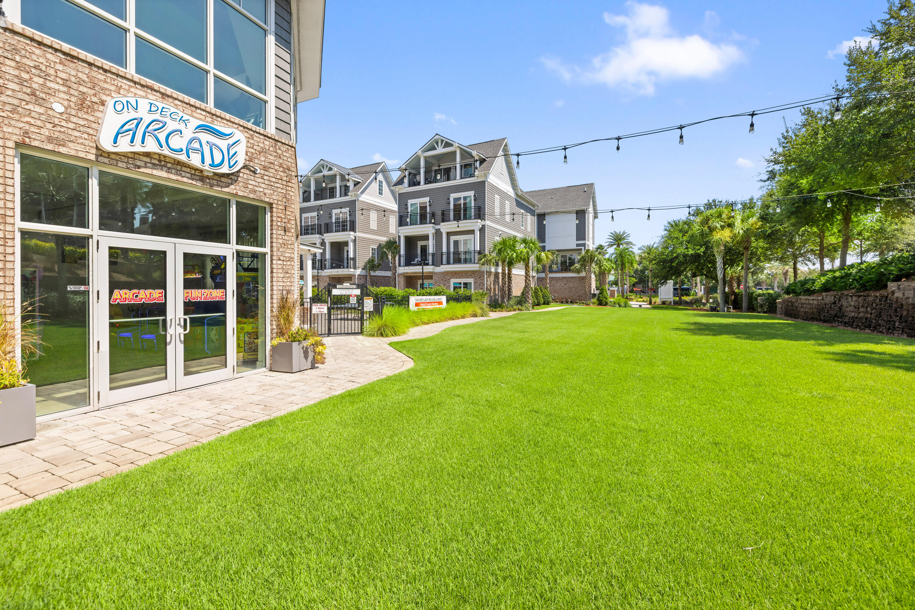 201 Henderson Resort Way, Unit 2202 Destin, FL 32541 - Photo 36 of 48 a view of a building with a yard