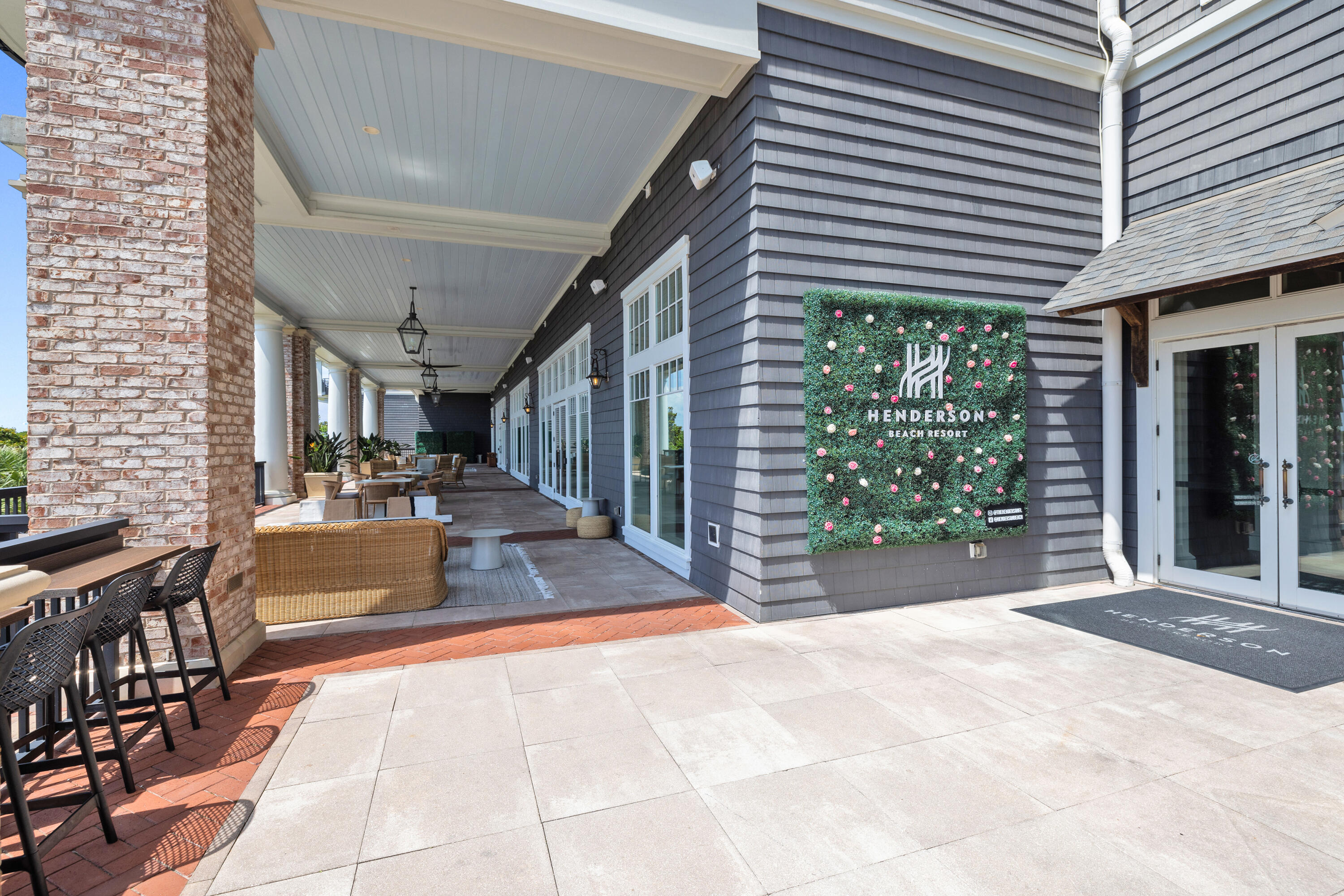 201 Henderson Resort Way, Unit 2202 Destin, FL 32541 - Photo 40 of 48 a view of a patio with table and chairs with wooden floor and fence