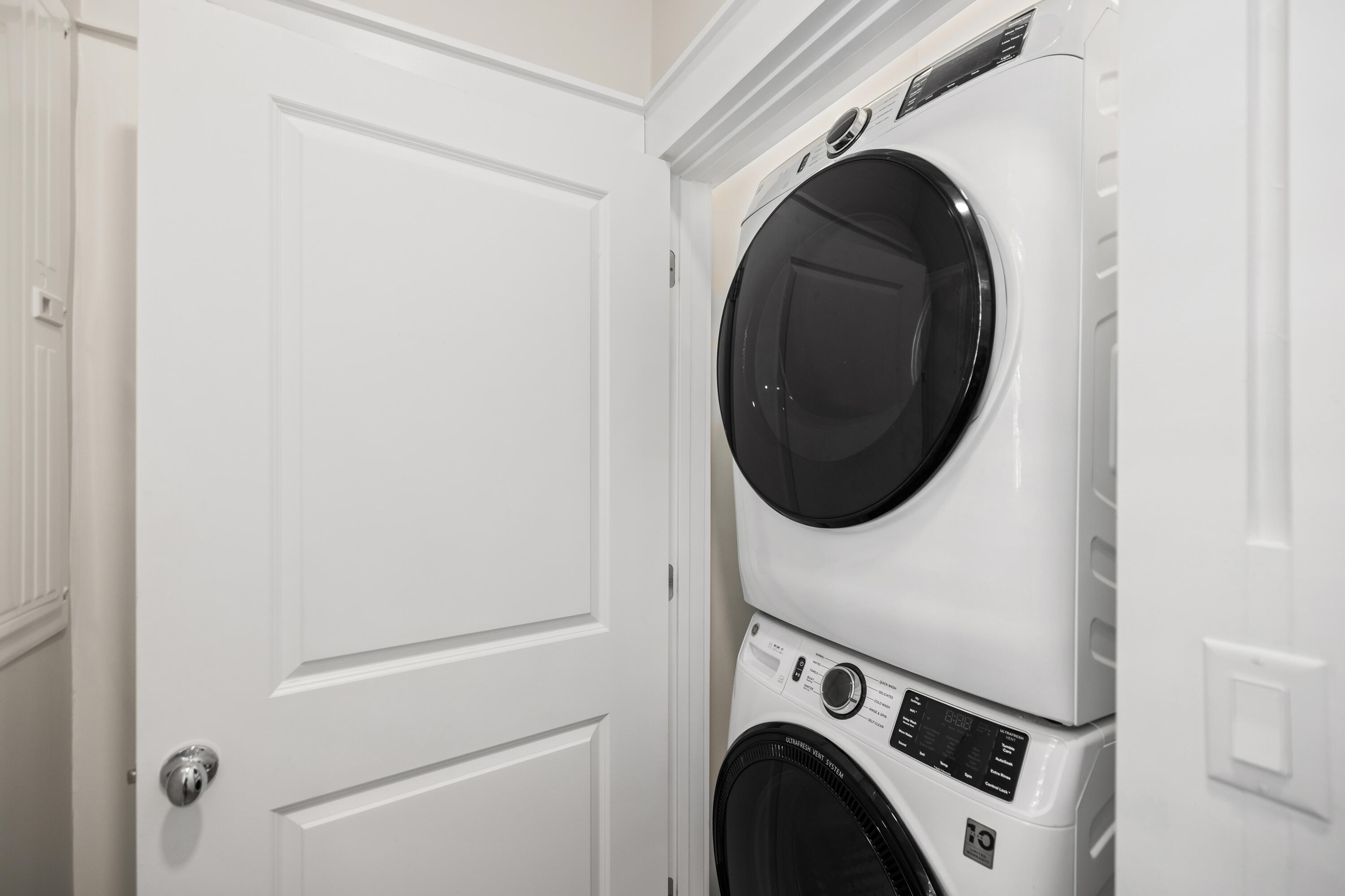 201 Henderson Resort Way, Unit 2202 Destin, FL 32541 - Photo 45 of 48 a utility room with dryer and washer