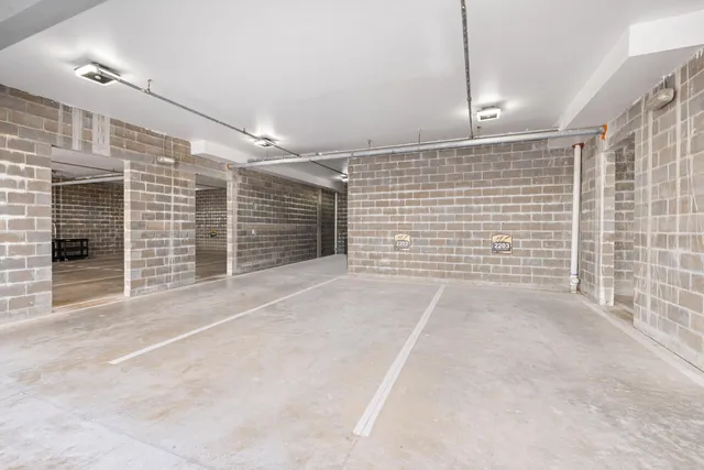 a living room with furniture a rug and white walls