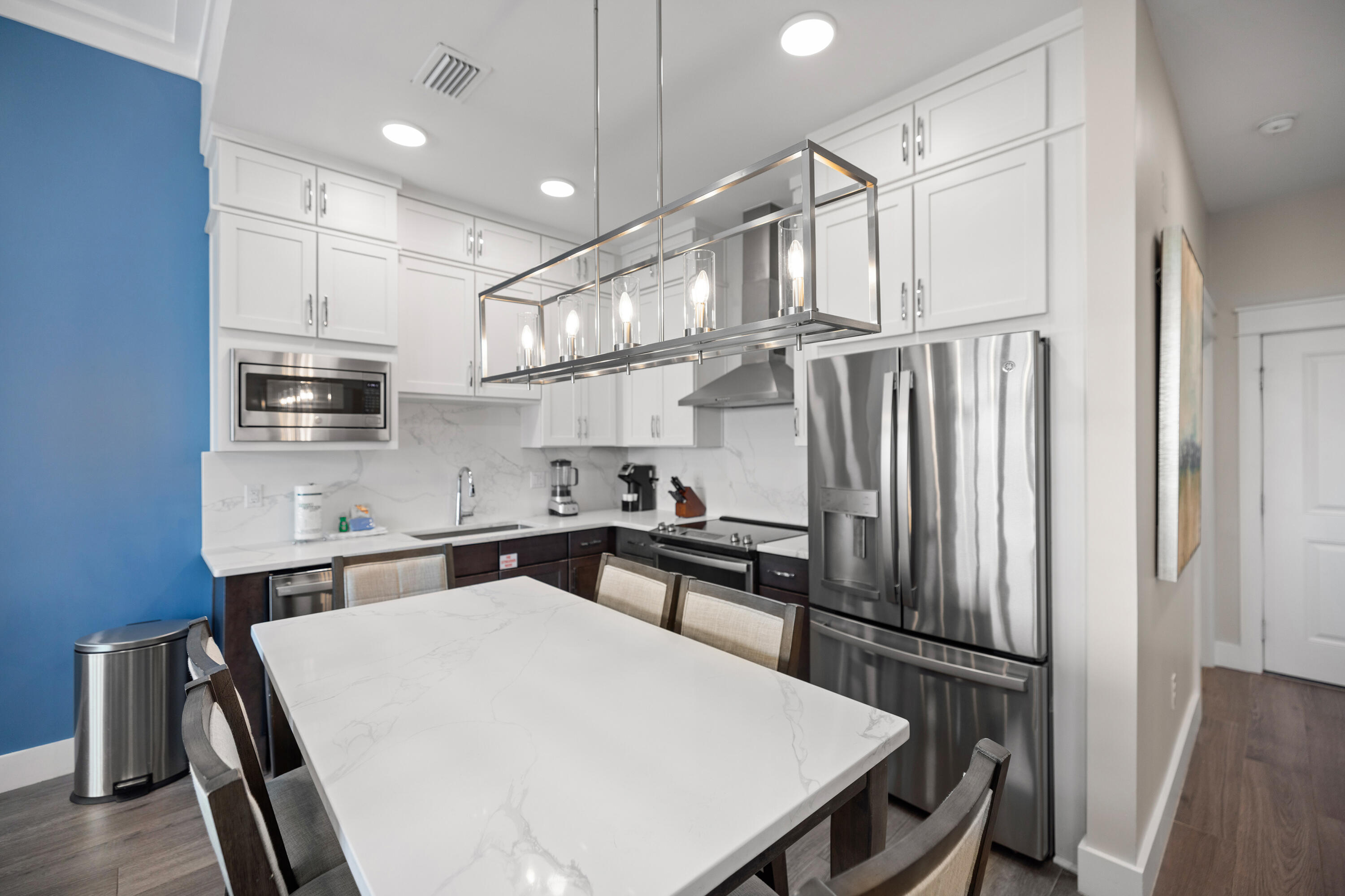 201 Henderson Resort Way, Unit 2202 Destin, FL 32541 - Photo 10 of 48 a kitchen with stainless steel appliances a refrigerator and a stove top oven