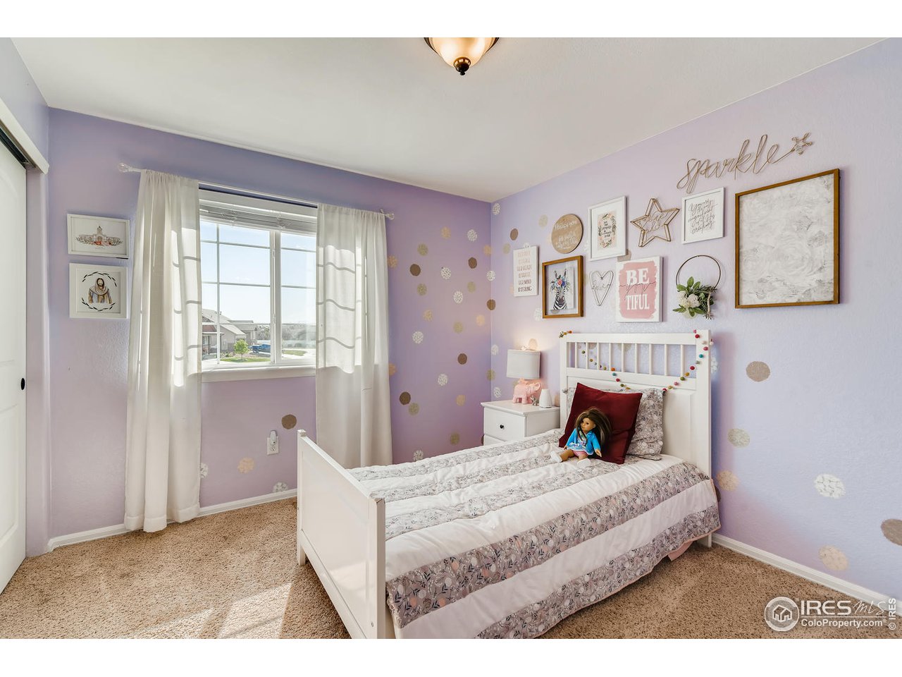 7501 21st Street Greeley, CO 80634 - Photo 19 of 27 a bedroom with a large bed and a window