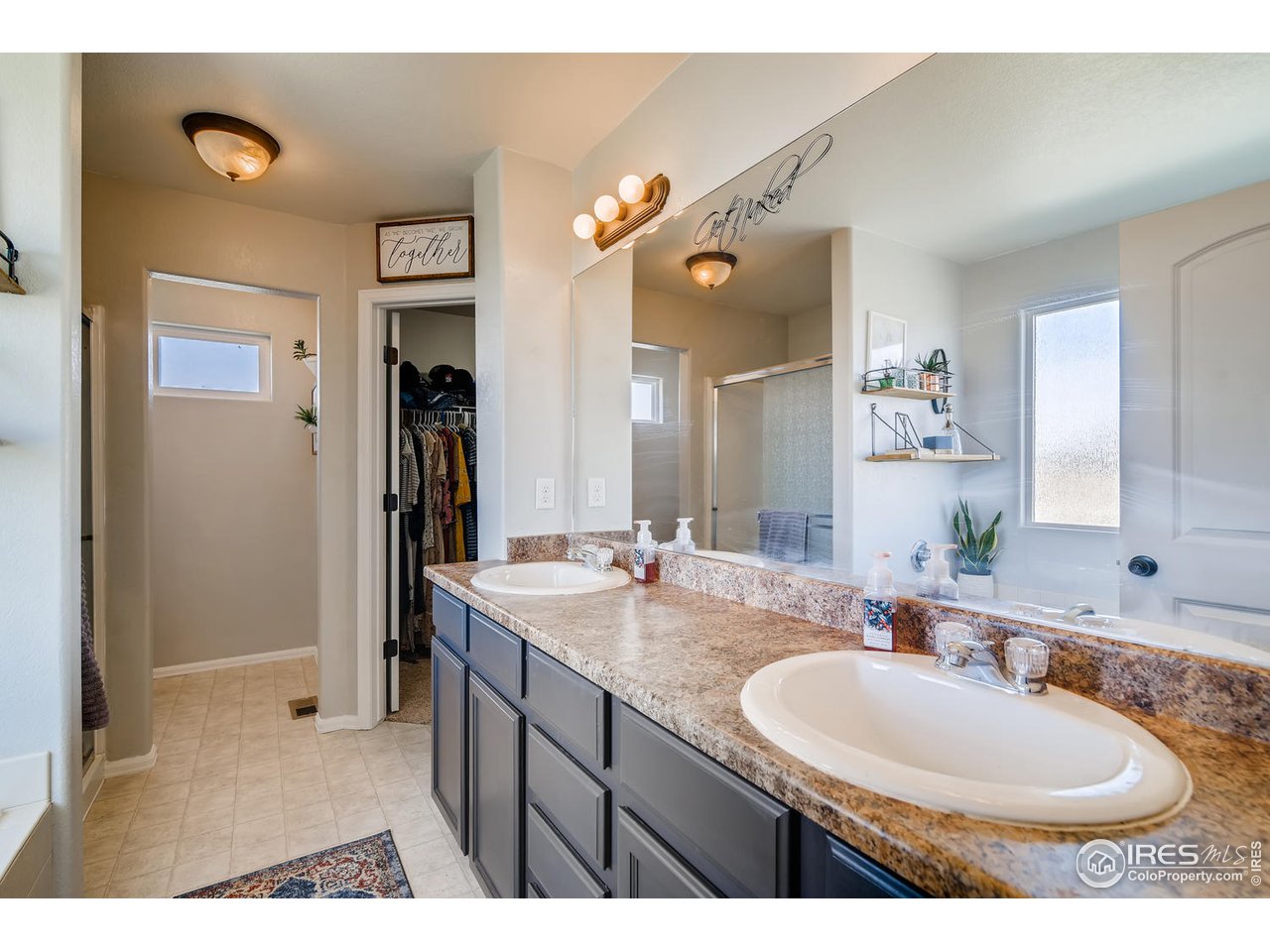 7501 21st Street Greeley, CO 80634 - Photo 20 of 27 a bathroom with a sink and a mirror
