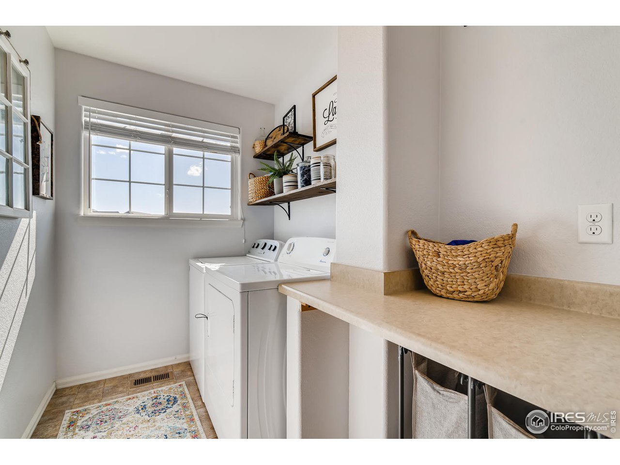 7501 21st Street Greeley, CO 80634 - Photo 25 of 27 a room with a sink cabinets and a window