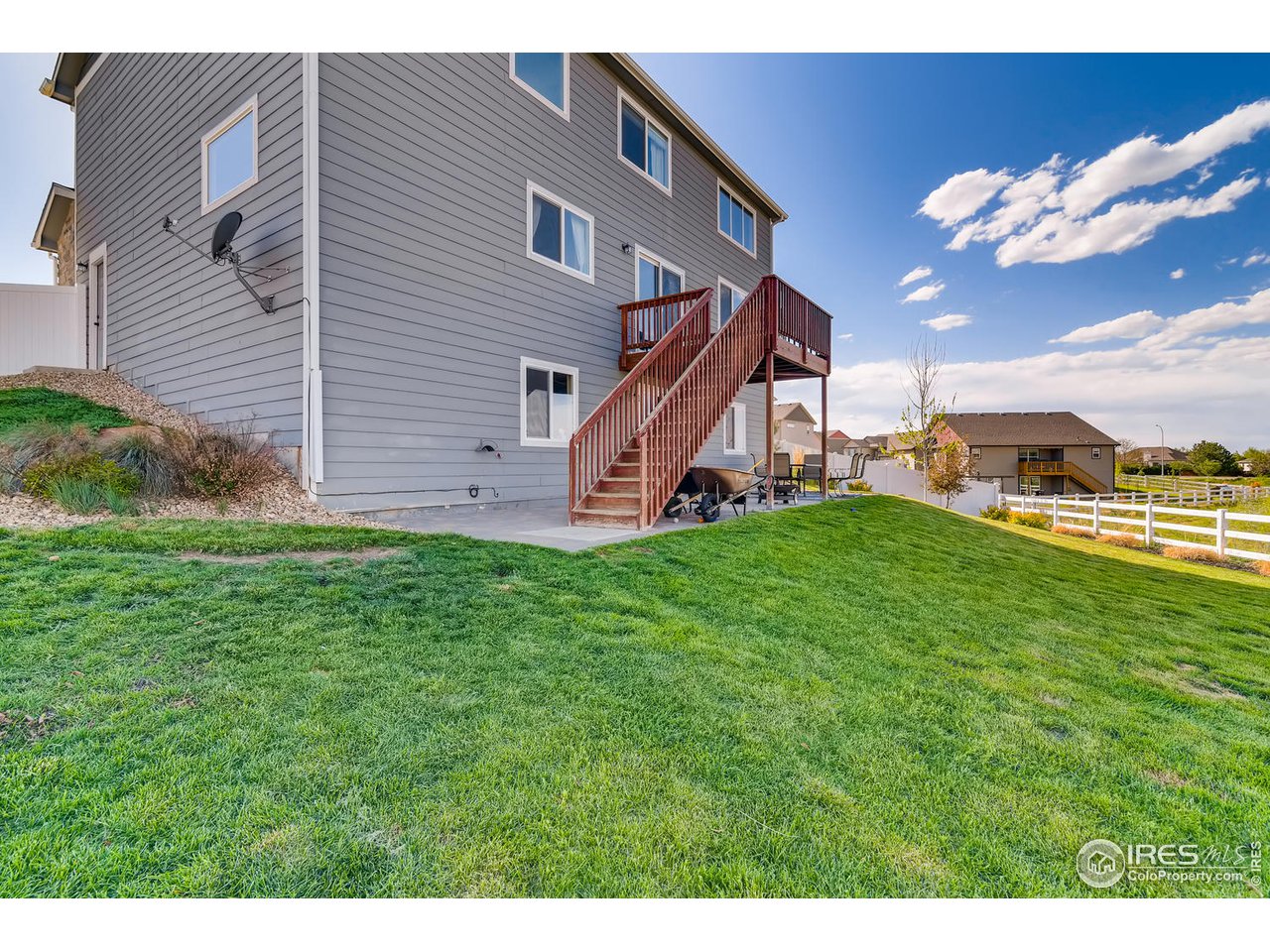 7501 21st Street Greeley, CO 80634 - Photo 27 of 27 a view of a house with a yard and sitting area
