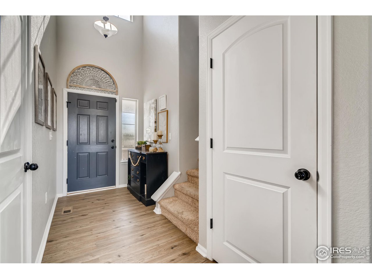 7501 21st Street Greeley, CO 80634 - Photo 7 of 27 a view of entryway with wooden floor