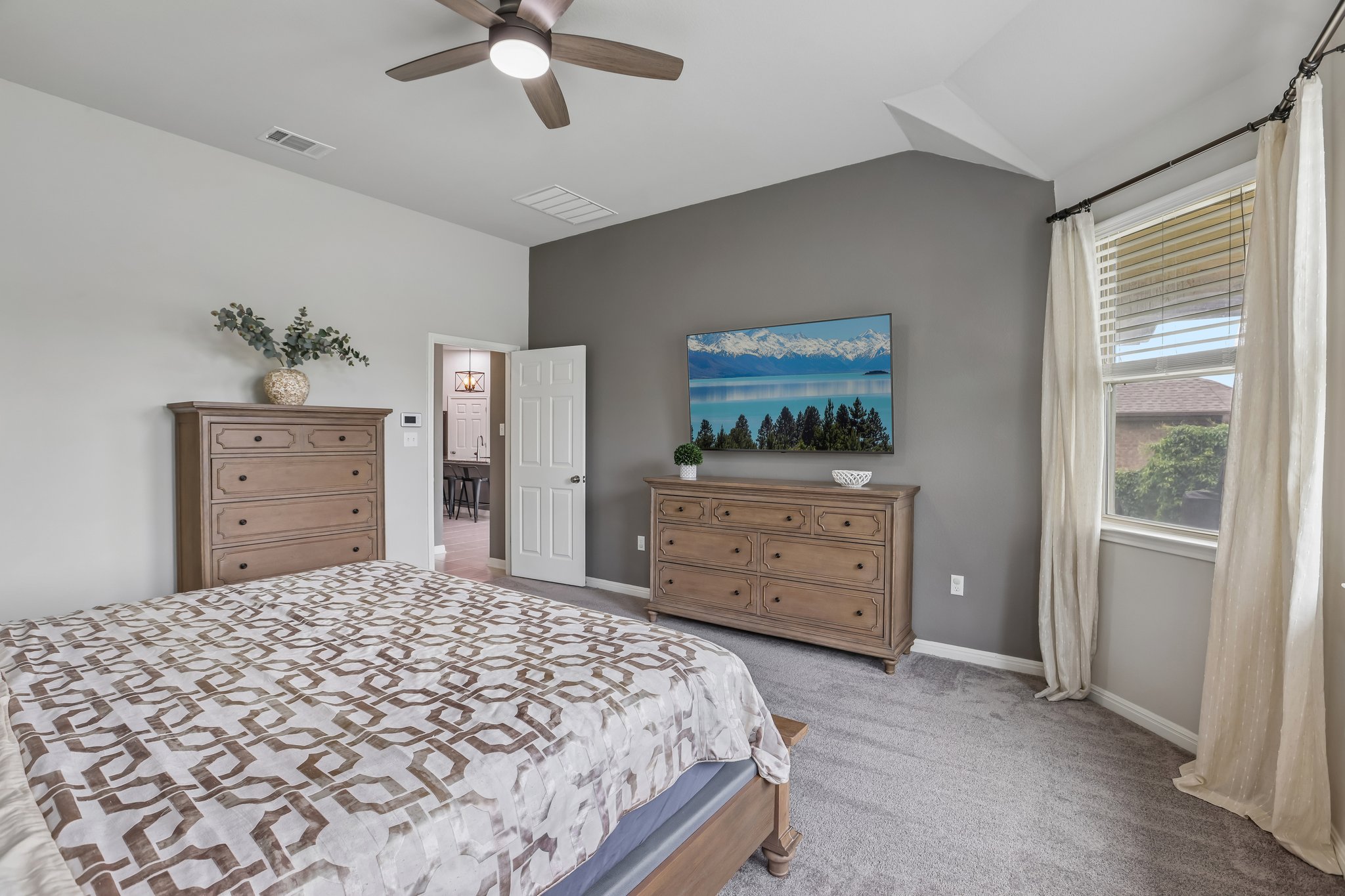 6801 Banff Cove Austin, TX 78754 - Photo 18 of 37 Comfortable primary suite with recently replaced soft carpet and abundant natural light from bay windows