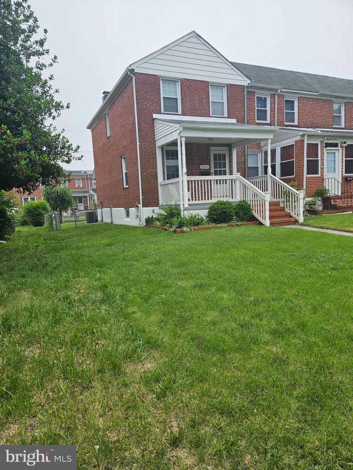 6907 Belclare Road Baltimore, MD 21222 - Photo 2 of 26 a front view of a house with a garden