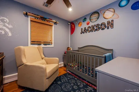 a bedroom with furniture and a window