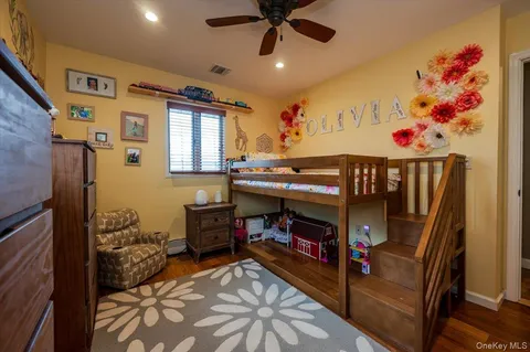 a bedroom with furniture and a window