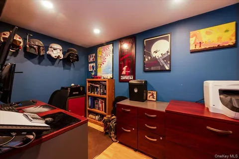 a room with furniture and screen flat screen tv