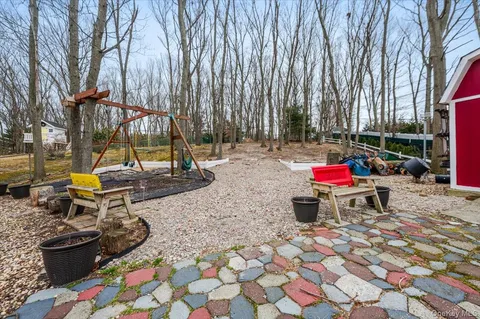 a view of a park with swings and slides