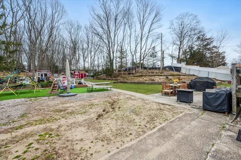 a view of a garden with sitting area