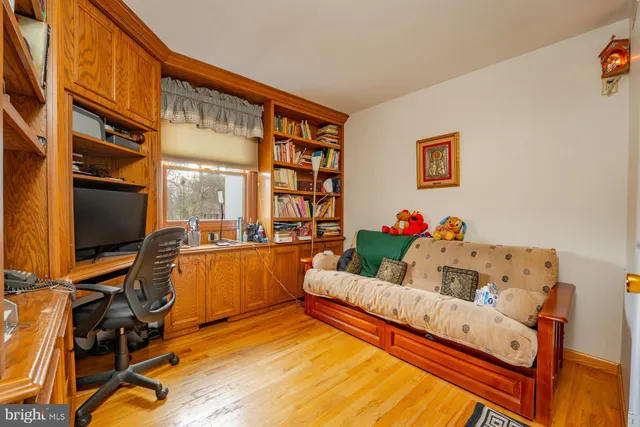 a kitchen with stainless steel appliances granite countertop a refrigerator and a white cabinets