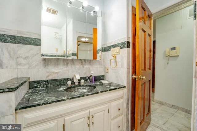 a front view of a house with stairs