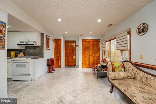 a swimming pool with trees in the background
