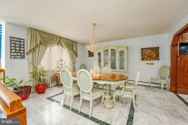 a living room with lots of furniture pool table and a table