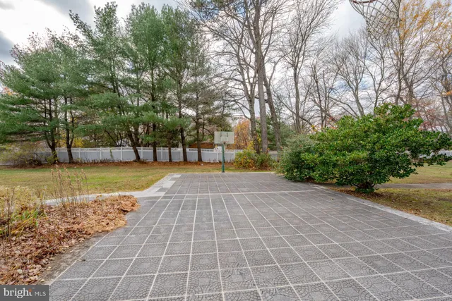 a living room with furniture a rug and a window