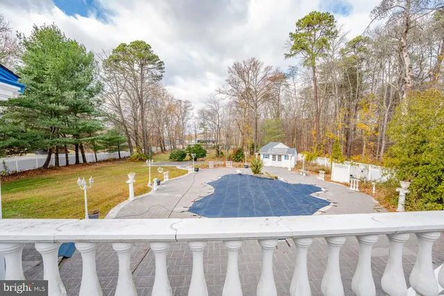 a view of a patio with a yard