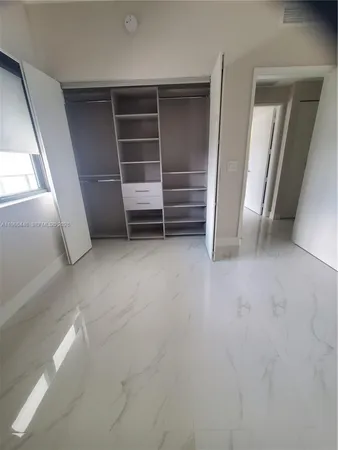 a view of an empty walk in closet