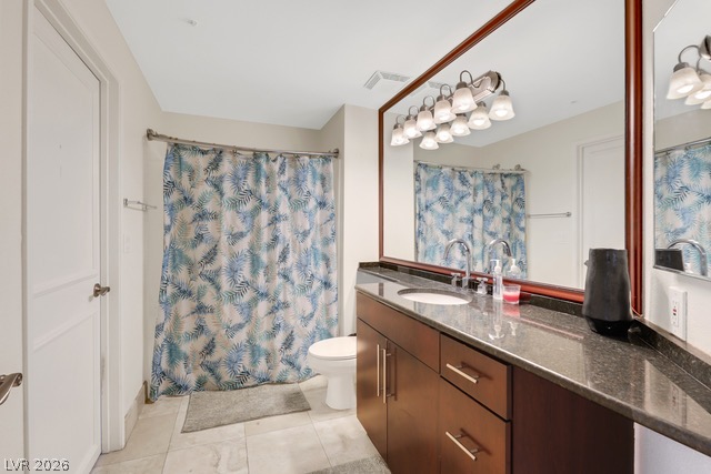230 East Flamingo Road, Unit 435 Las Vegas, NV 89169 - Photo 8 of 15 Granite counters and dual sinks define this well-appointed bathroom.