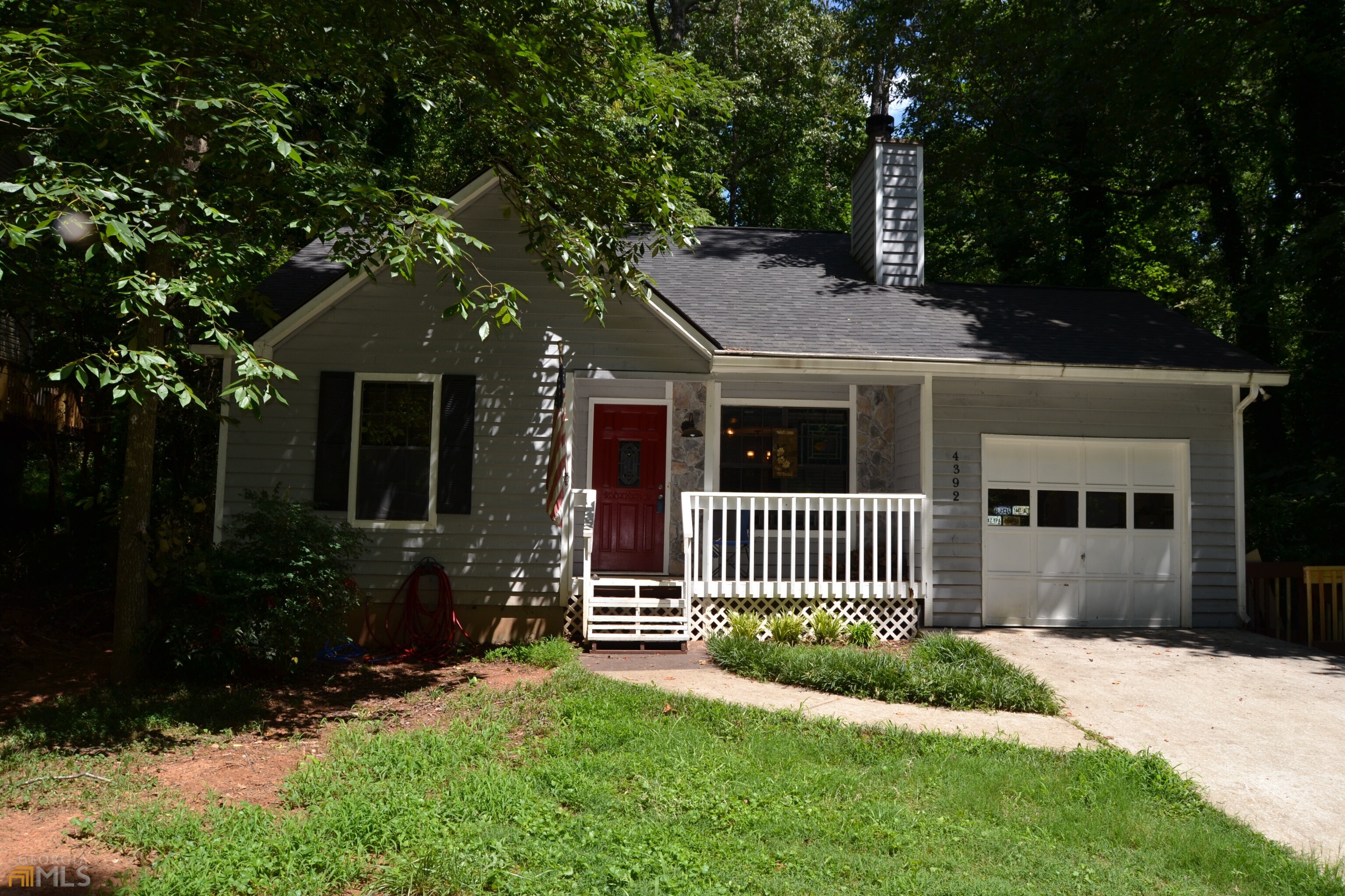 4392 Marjorie Road Southwest Snellville, GA 30039 - Photo 1 of 1 a front view of a house with a yard