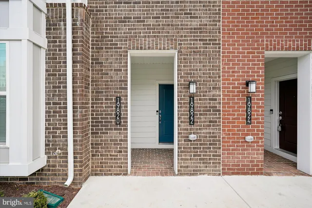 a view of a cars park in front of a house